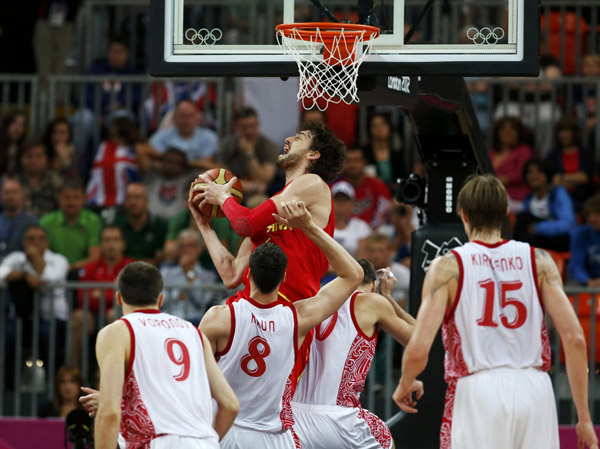 Spain's Pau Gasol grabs a rebound in his game against Russia during their men's basketball preliminary round, Group B match at the Basketball Arena during the London 2012 Olympic Games August 4, 2012.  Russia beats Spain in men's basketball