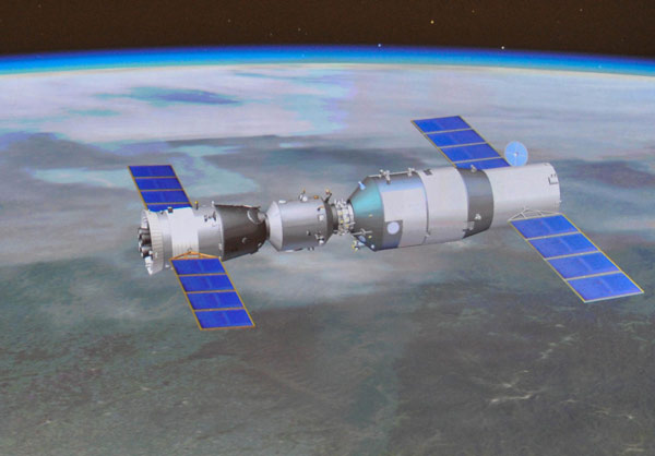 conducting docking with the orbiting Tiangong-1 space module Shenzhou X docks with space module