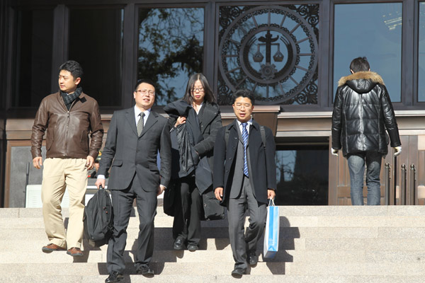 Lawyers representing Qihoo 360 Technology Co leave the Supreme People’s Court on Tuesday at noon after court adjourned. The court opened the trial against Tencent Inc, which is accused by Qihoo of “abusing its dominant position in the market”. ZHU XINGXIN / CHINA DAILY First Web monopoly case opened