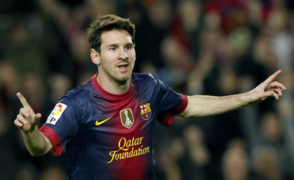 Barcelona's Lionel Messi celebrates a goal against Zaragoza during their Spanish First division soccer league match at Camp Nou stadium in Barcelona, Nov 17, 2012. Yearender soccer: Glory for Spain and Messi but problems never far away