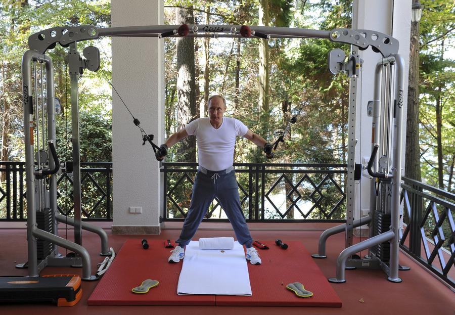 Russia's Putin works out in gym with Medvedev